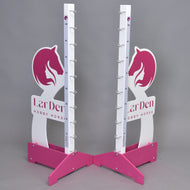 Two pink and white Hobby Horse LarDen jump 110 cm / 43 inch stands with horse head designs, adjustable height markings, and metal cup holders stand on a gray background. "LarDen HOBBY HORSE" is printed on the base.