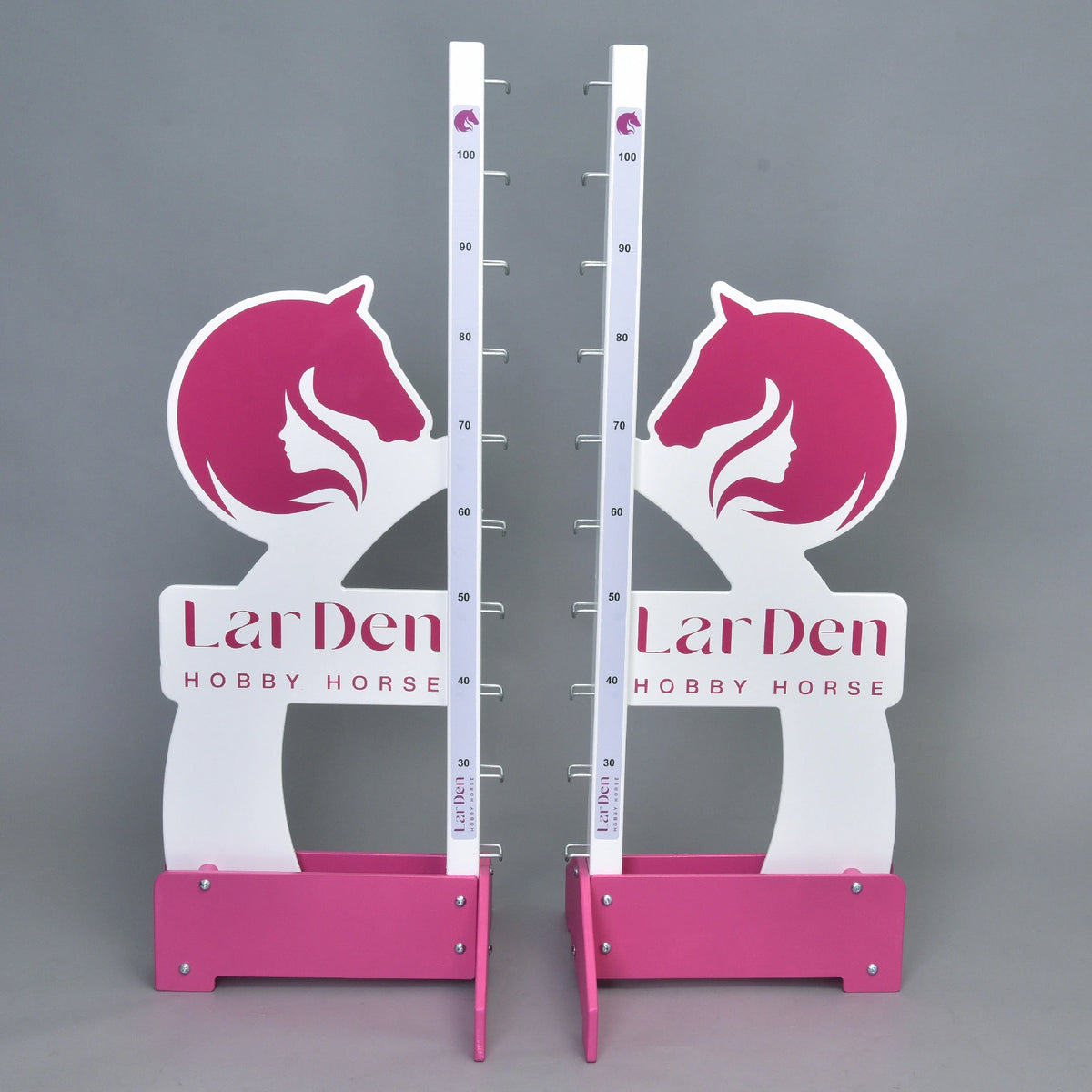 The two stands facing forward, mirror-image wings with the pink logo and a height scale from 30 to 100 cm