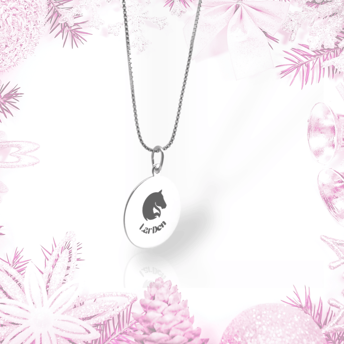 The Silver necklace with LarDen pendant by Hobby Horse LarDen features a round 925 silver pendant with a black horse head and "LarDen" text, shown against a pink and white holiday border—perfect for hobby horsing fans.