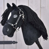 The Hobby Horse LarDen "Cloony" features a black plush design modeled after an American Quarter Horse stallion, with a white spot near the eye, black yarn mane, and a black halter, displayed on a light wooden background.