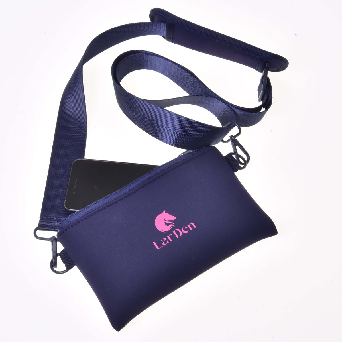 A navy blue Cross body by Hobby Horse LarDen features neoprene material, zip closure, long adjustable strap, a visible smartphone partly inside, and a pink horse logo with "LarDen" text on the front.