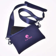 A navy blue Cross body by Hobby Horse LarDen features neoprene material, zip closure, long adjustable strap, a visible smartphone partly inside, and a pink horse logo with "LarDen" text on the front.