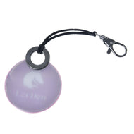 A round, purple reflective Keychain round LarDen by Hobby Horse LarDen with a black elastic loop, metal clasp, and subtle cat head logo with "Cat Den" text—ideal for hobby horsing fans.