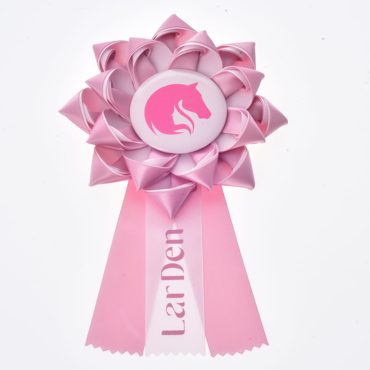 Hobby Horse Ribbon LarDen Pink, a light pink satin rosette with a pink horse head on a white badge and three zigzag tails