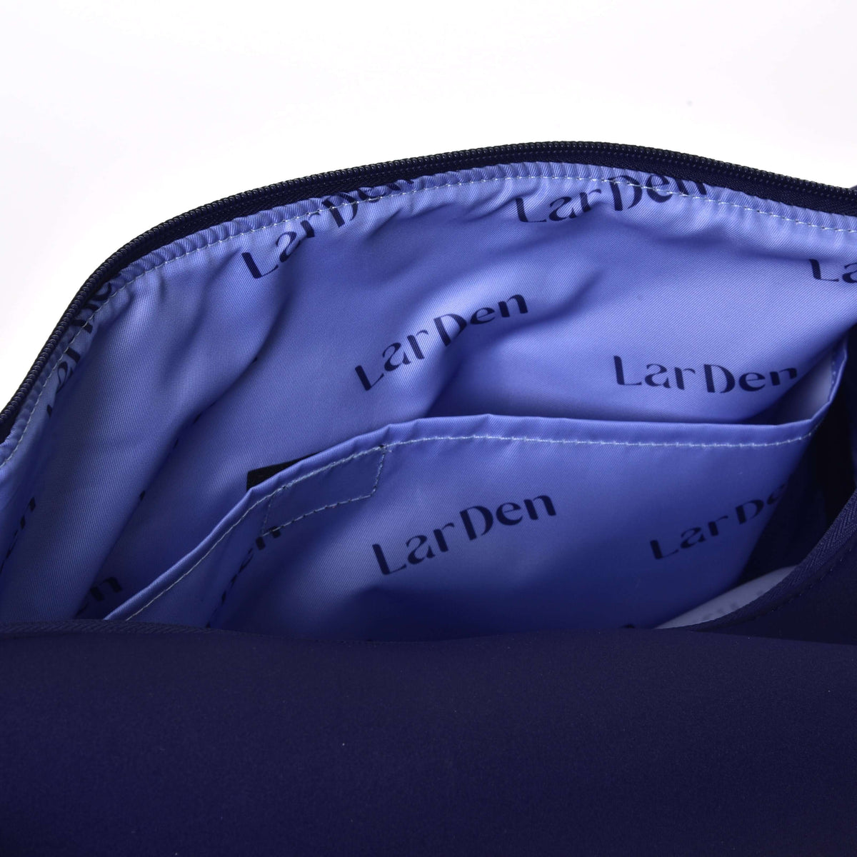 Open Hobby Horse Sports bag showing the lilac lining printed with LarDen and a slip pocket inside