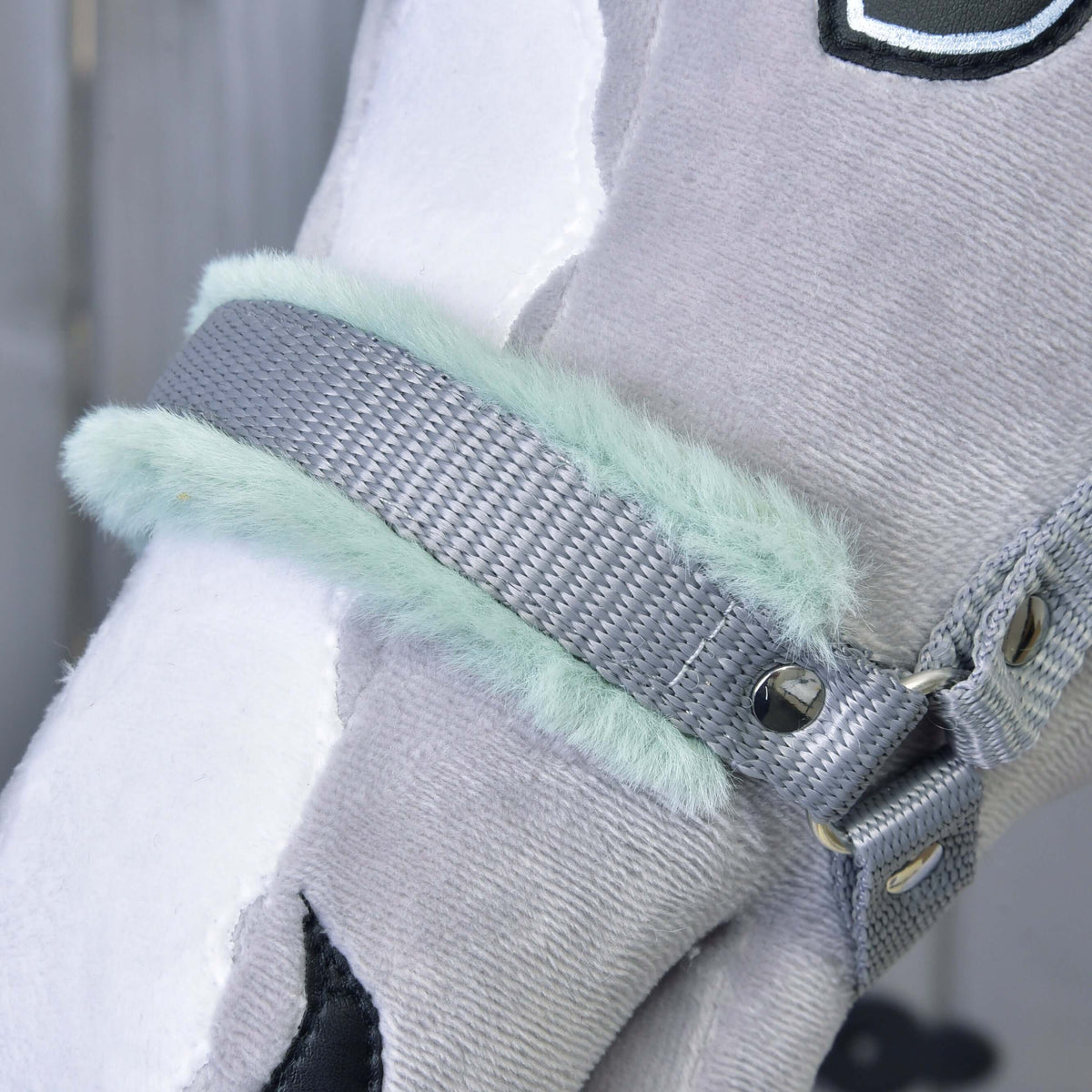 Close-up of the grey webbing noseband with soft mint fur padding and a silver rivet on a grey plush Hobby Horse