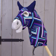 The Hobby Horse LarDen Hobby Horse protective suit blue (Lycra) features a colorful geometric-patterned head with a large brown eye, black ears, and white snout on a wooden stick, displayed in front of a wooden fence.