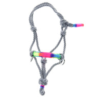 The Rope halter Manhattan by Hobby Horse LarDen is a gray rope halter with multiple knots, metal rings, and vibrant rainbow thread accents—an eye-catching hobby horse accessory shown on a white background.