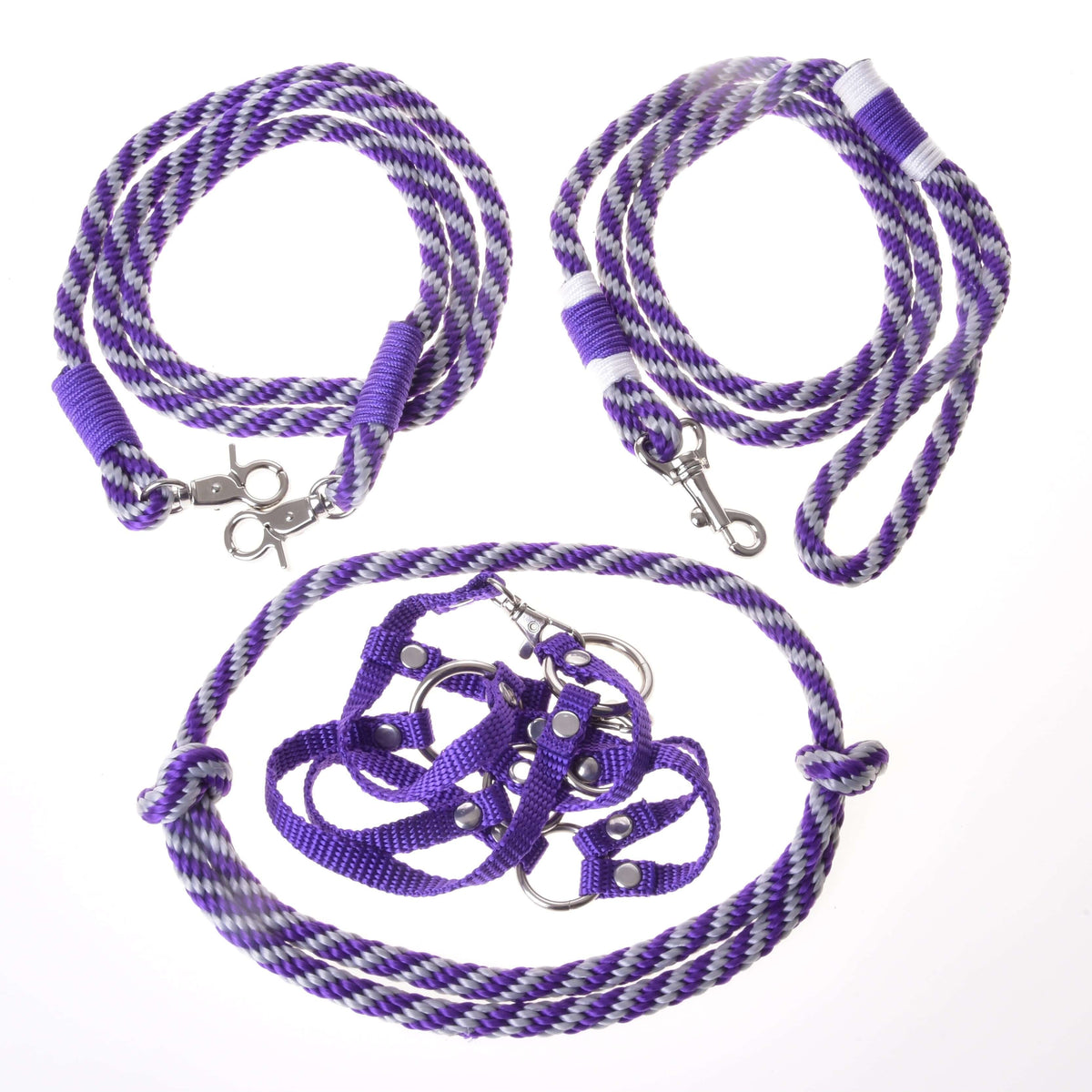 The Set Start Purple by Hobby Horse LarDen includes a halter, cordeo, lead rope, and reins in purple and white stripes—perfect as halter and leash or Hobby Horse accessories. All items are displayed on a white background.