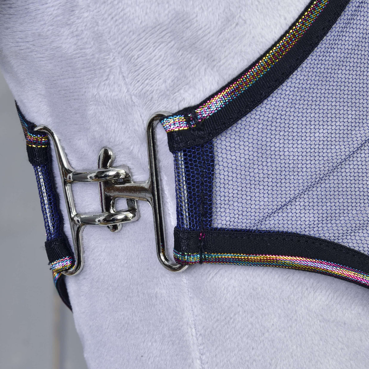Close-up of a shiny metal clasp fastening two pieces of PES mesh fabric with dark edges and rainbow trim on the Fly sheet LarDen by Hobby Horse LarDen, shown against a white background.