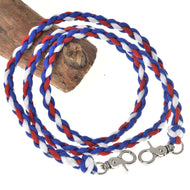 The Hobby Horse LarDen Reins Flag CZ features a durable red, white, and blue braided polypropylene cord with silver swivel lobster clasps at both ends, neatly coiled on wood.