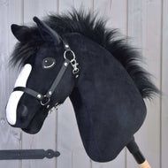 Hobby Horse LarDen's Loki features a black plush body, white facial stripe, and black halter. Mounted on a wooden stick and set against a light wooden panel—ideal for dressage-themed play.