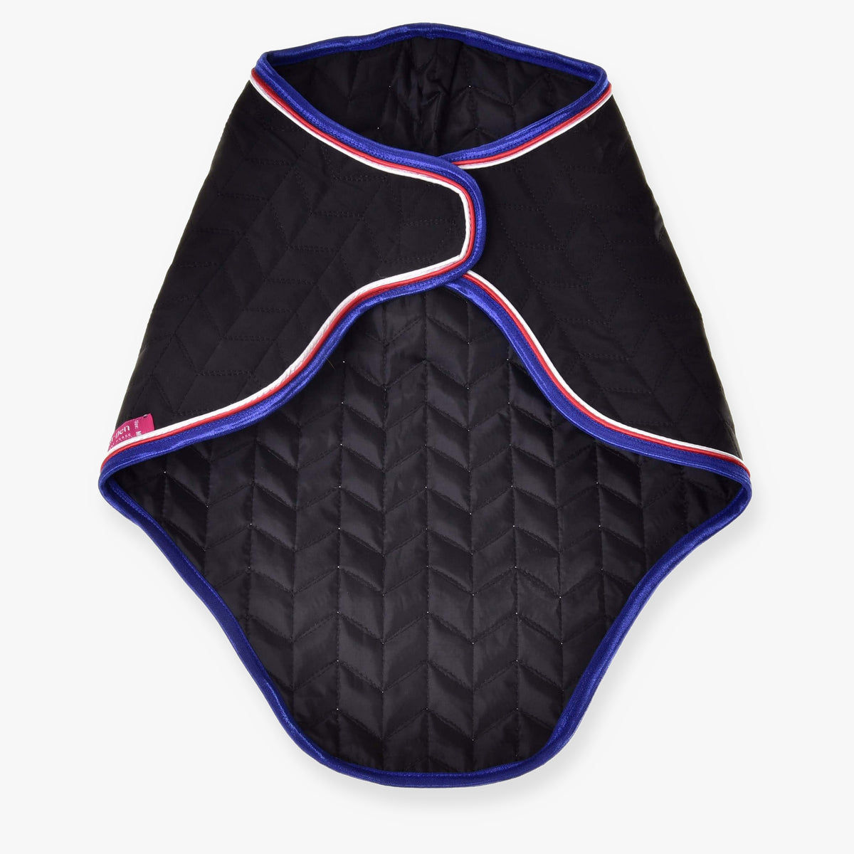 The Hobby Horse LarDen Travel Rug Luxury is a black quilted pet coat with blue edges and red, white, and blue trim, featuring a curved overlapping front—styled like an elegant horse rug for that signature Hobby Horse Travel Rug look.