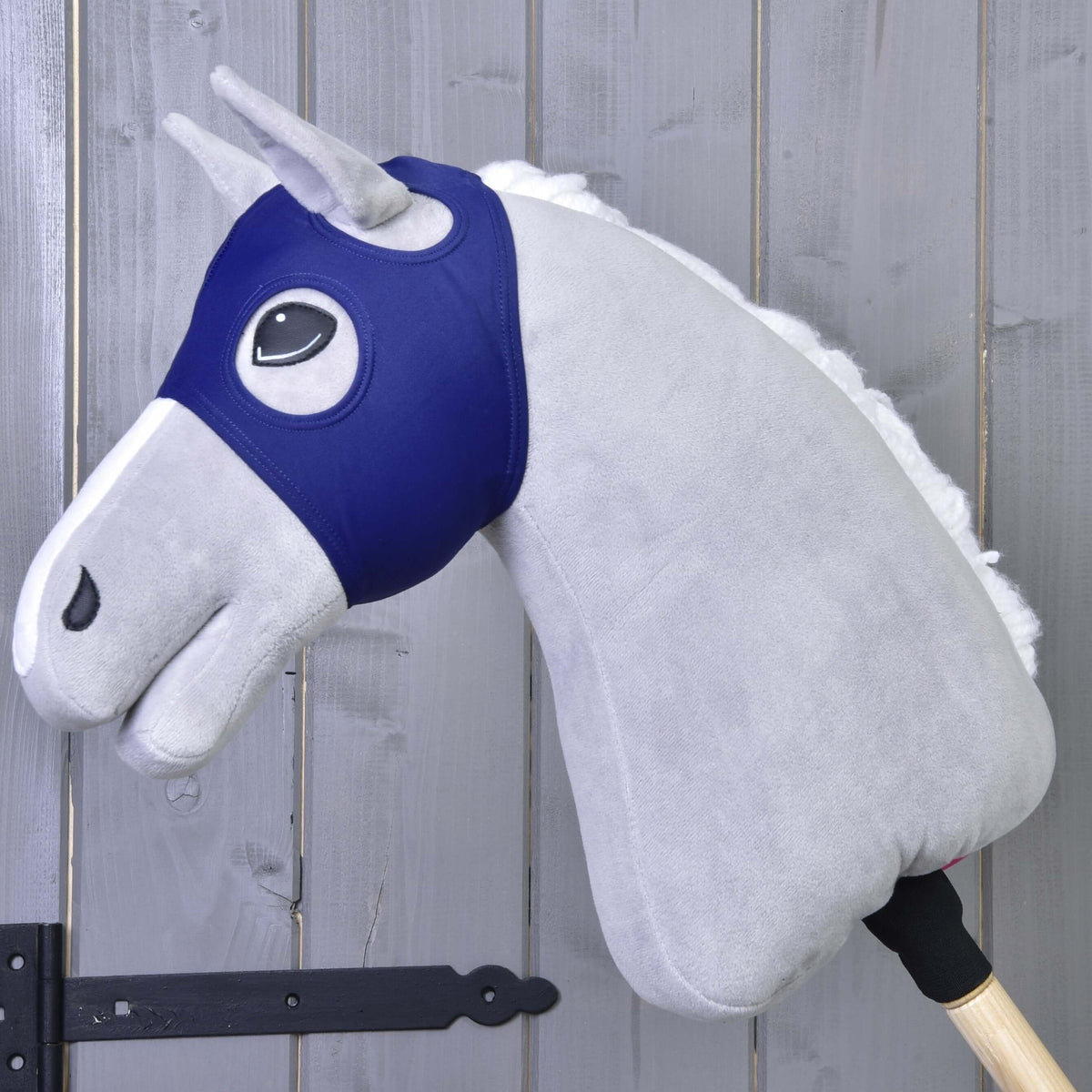 Horse Mask without ears LarDen in navy stretch fabric on a grey plush Hobby Horse, its own ears poking through