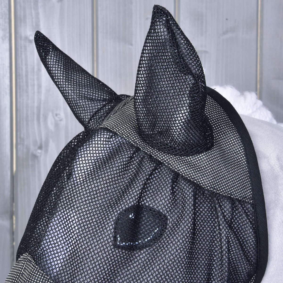 Close-up of the black mesh ears and eye net on the Hobby Horse Fly Mask De Luxe Grey, the eye visible underneath