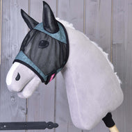 The Hobby Horse LarDen Fly Mask De Luxe Turquoise is displayed on a gray plush hobby horse with a white muzzle, shown posed against wooden planks. The washable mask offers stylish protection for your hobby horse.