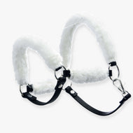 The Hobby Horse LarDen Fur Halter Teddy Classic is a black faux leather halter with white faux fur padding on the noseband and crownpiece, featuring metal rings and a secure clasp.