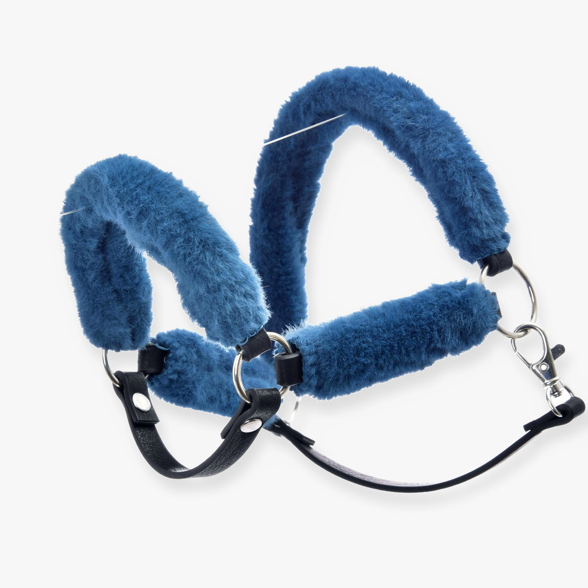 The Fur Halter Teddy Petrol by Hobby Horse LarDen features blue fluffy fur, black leather straps, and silver metal rings and clasp for comfortable, secure placement on a horse's head.