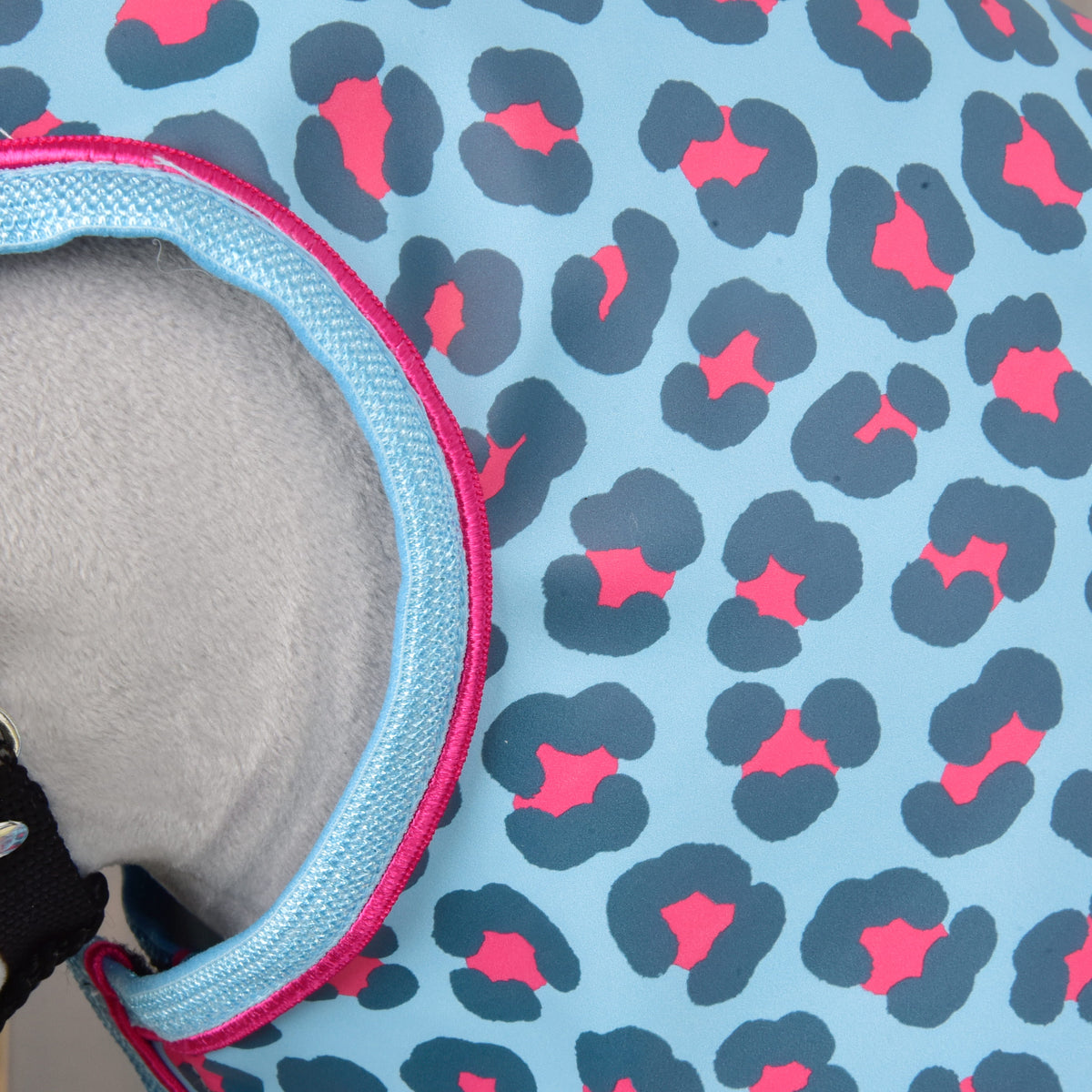 Close-up of the Raincoat Blue Leopard by Hobby Horse LarDen, featuring light blue fabric with dark blue and pink leopard print and a light blue trim—ideal for rides in any weather.