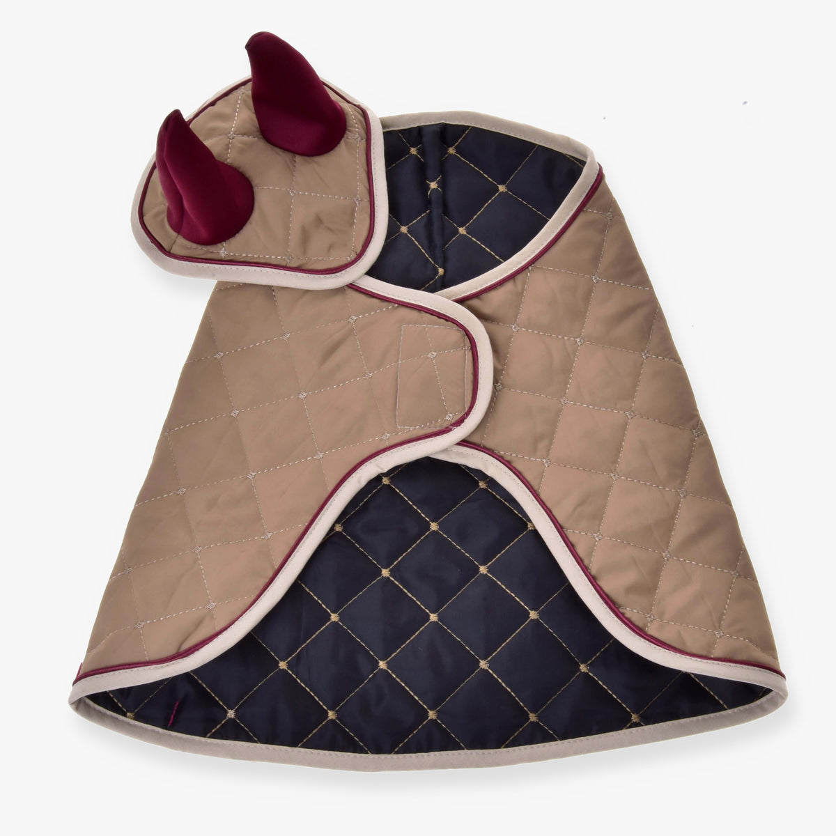 The Set Roma by Hobby Horse LarDen is a beige and navy blue quilted pet coat with diamond stitching, white trim, and dark red ear accents on the hood—ideal for pets who love cozy blanket set comfort.