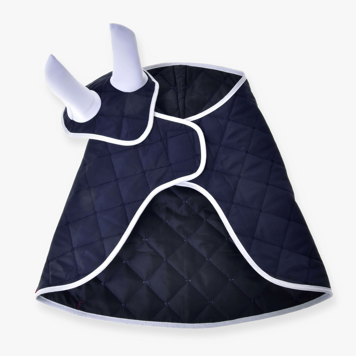 The Set Monte dog coat from Hobby Horse LarDen is a navy blue quilted coat with white trim, two leg openings, and a chest flap—perfectly styled to match your favorite horse decoration or Hobby Horse blanket.
