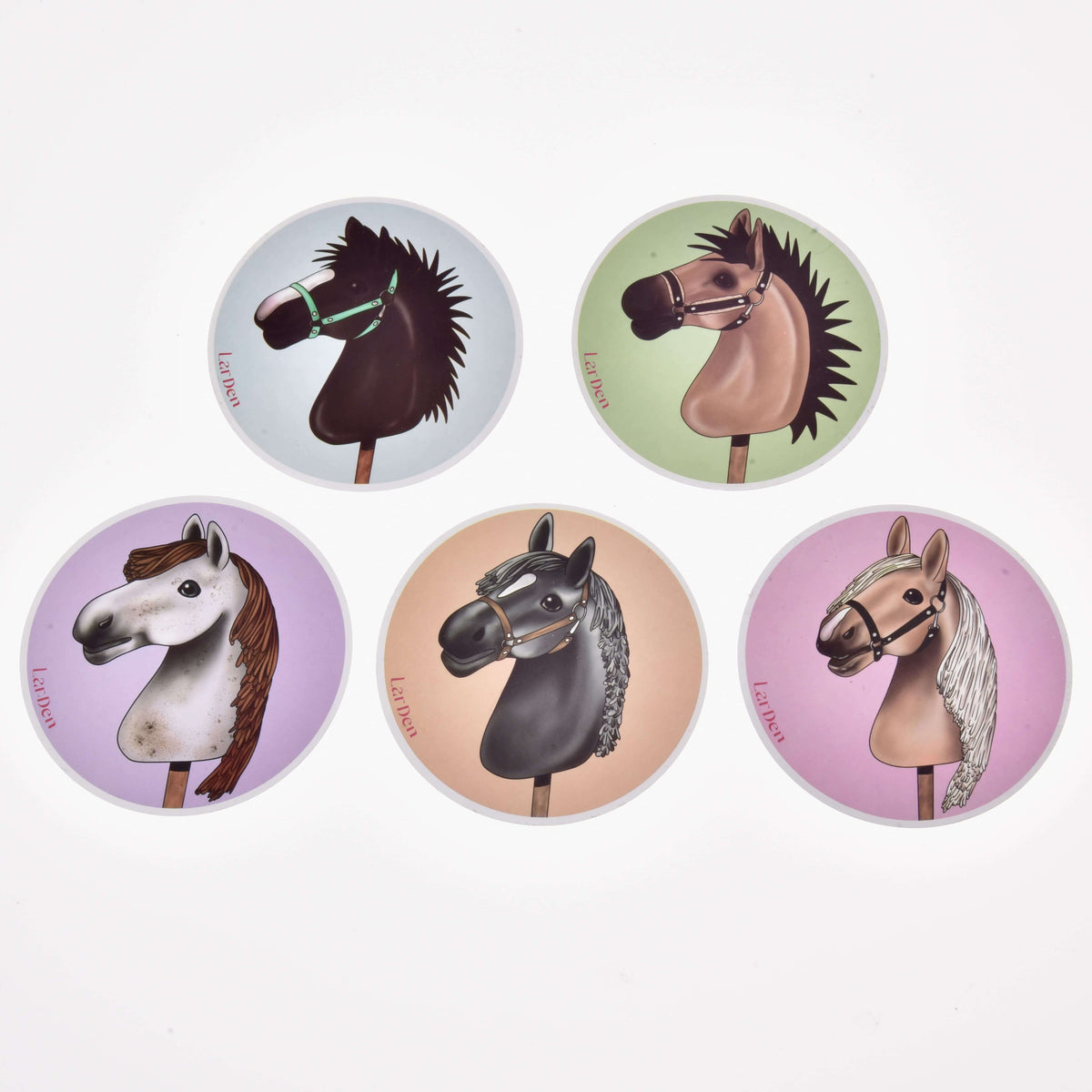 Set Stickers New from Hobby Horse LarDen features five stickers, each with a unique illustrated Hobby Horse head on colored backgrounds (blue, green, purple, red, pink)—a perfect choice for fans or as distinctive decorations.