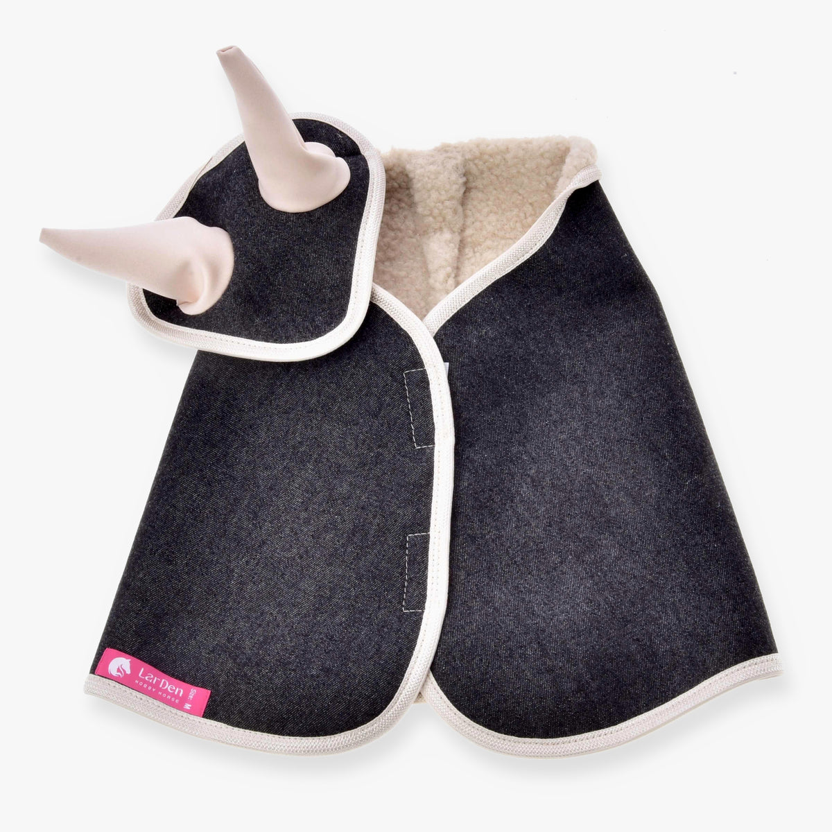 The Set Blue Denim dog jacket by Hobby Horse LarDen is made of blue denim with white trim, two plush horns near the neck for a playful horse-inspired touch, a pink label in the corner, and cream-colored fleece lining inside.