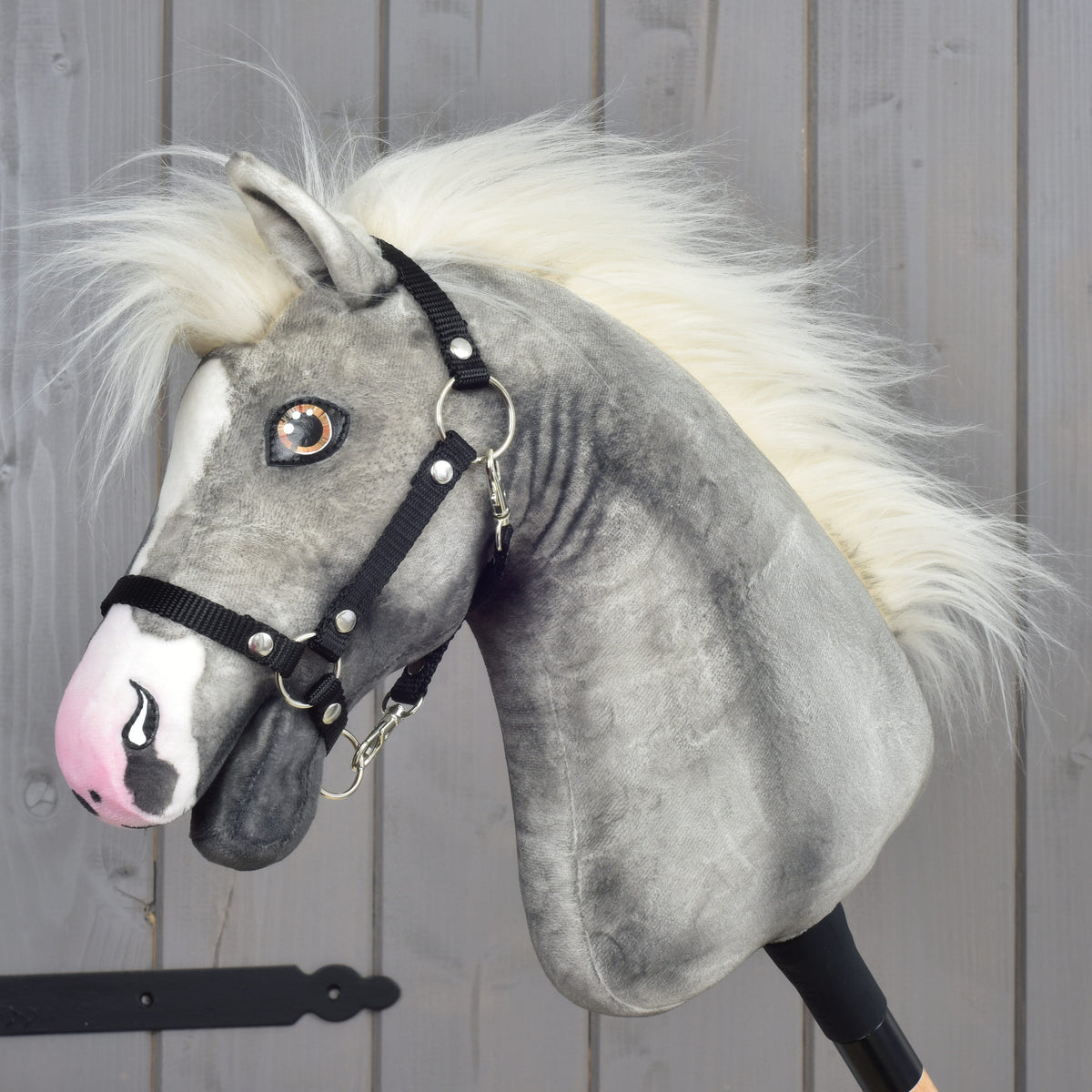 Hobby Horse Silver Moon by LarDen, a mottled grey plush head with a cream mane, white blaze, pink nose and black halter