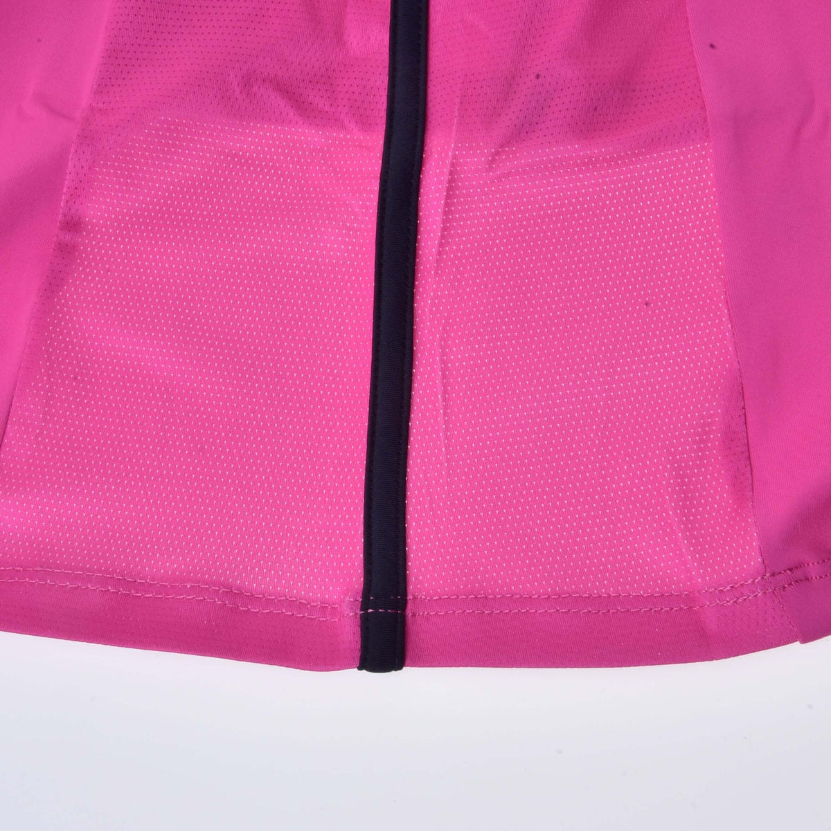 Close-up of the perforated mesh panel and black piping at the hem of the pink Hobby Horse T-Shirt
