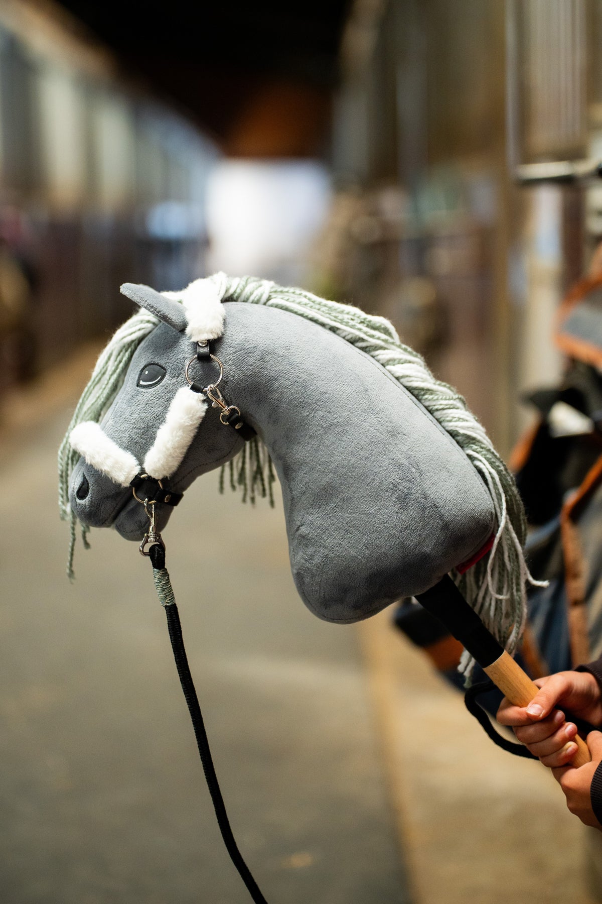Hobby Horse Fur Halter Teddy Classic worn on a grey plush head with white fur trim and black lead