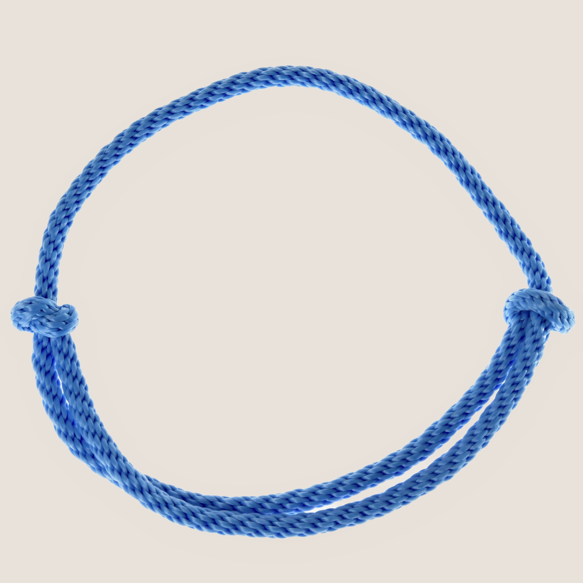 The Cordeo Sky by Hobby Horse LarDen is a blue braided rope handmade cordeo in a simple closed loop with two knots on opposite sides, shown on a white background. Ideal for hobby horse riding or bitless riding.
