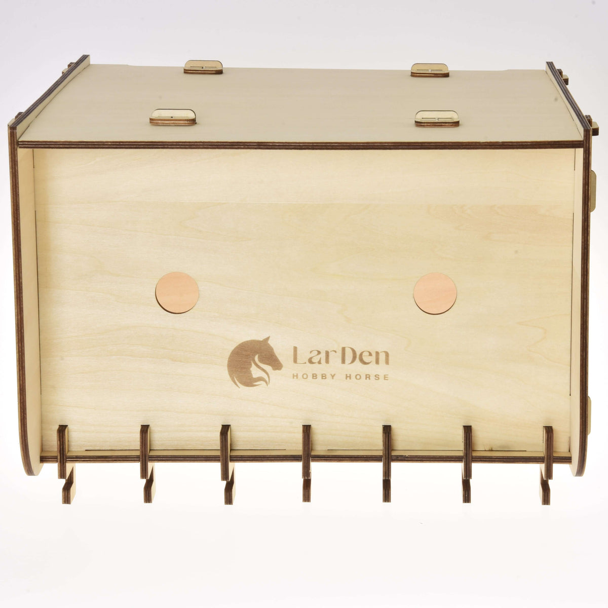A rectangular wooden holder labeled "Stable for 2 Hobby Horses" by Hobby Horse LarDen, with rounded edges, two circular holes, bottom slots, and a horse head logo engraved on the front.