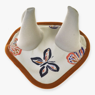 The Ear Bonnet Butterfly (softshell) by Hobby Horse LarDen is a fabric baby bib featuring soft white horns and a colorful butterfly pattern, inspired by insect-protection ear bonnets and finished with a brown border.