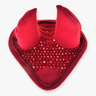 The Hobby Horse LarDen "Ear bonnet crocheted red" is a red heart-shaped headband with two soft, upright devil horns and a sparkly sequined center, inspired by a crocheted design, shown on a white background.