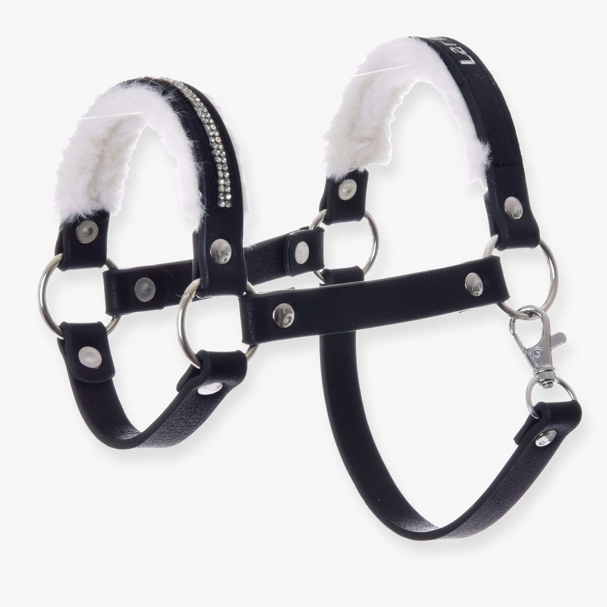 The Halter with fur - leatherette Espresso by Hobby Horse LarDen is a black leatherette pet harness with silver studs, metal rings, soft white faux fur lining, and rhinestones, inspired by hobby horse halter designs for comfort and security.