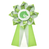 The Hobby Horse LarDen Hobby Horse Ribbon Green features a rosette with a horse head silhouette in the center and comes in green, white, and light green. This show ribbon has two tails with zigzag-cut ends.