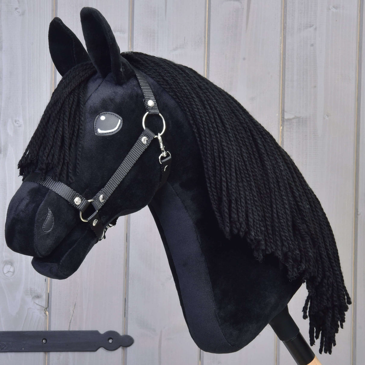 Hobby Horse Mahal with Black Halter by LarDen, a black plush head with a long black yarn mane, side view