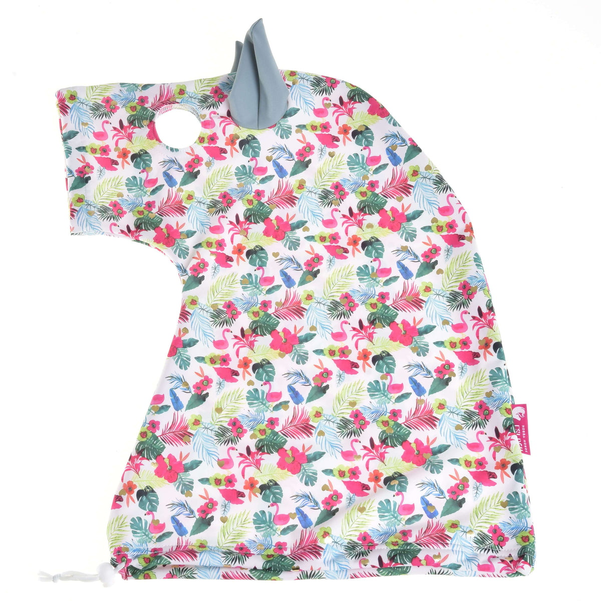 Tropical print protective suit laid flat from the side, white Lycra with pink flamingos, palm leaves and a sage ear