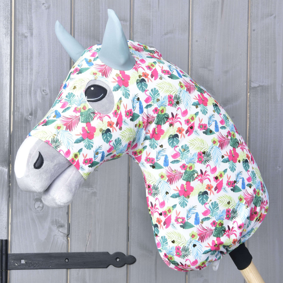 Hobby Horse protective suit LarDen Star (Lycra) on a grey head, white tropical print with pink flowers and sage green ears