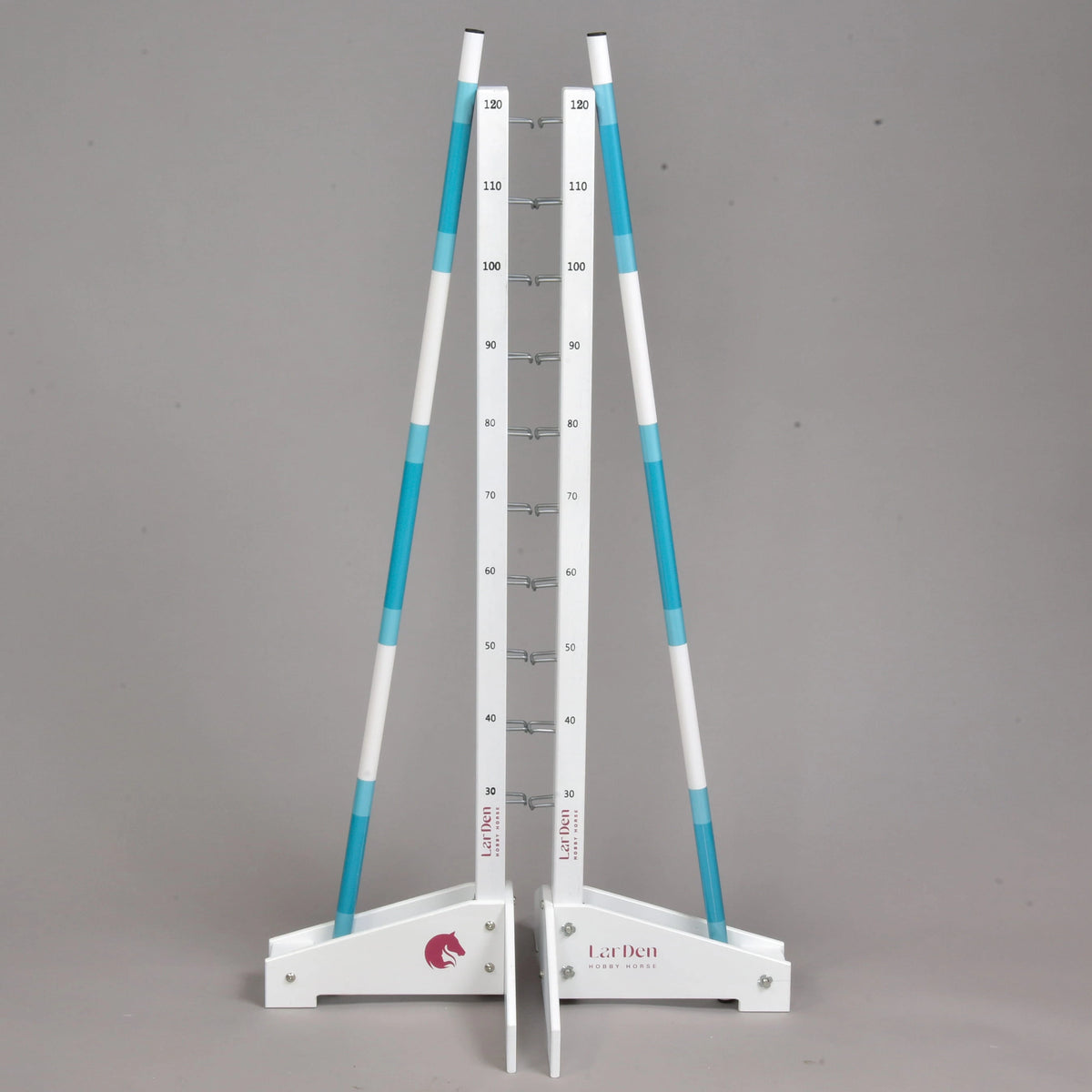 Both white stands side by side with the two turquoise and white poles leaning on them and the LarDen logo on the feet