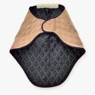 The Hobby Horse LarDen Travel Rug Paris is a quilted tan and dark gray pet coat with diamond stitching, lightweight durable fabric, and a faux fur collar, inspired by horse transport protection, shown laid flat on a white background.