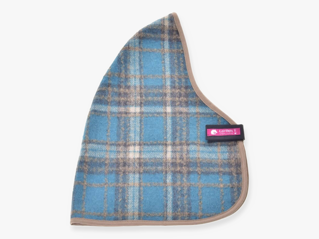 The Hobby Horse LarDen Stable Blanket Scottish Cube is a blue and beige plaid fabric with rounded triangular edges, taupe trim, and a small pink and black label tag sewn on one side.