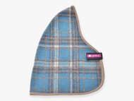 The Hobby Horse LarDen Stable Blanket Scottish Cube is a blue and beige plaid fabric with rounded triangular edges, taupe trim, and a small pink and black label tag sewn on one side.