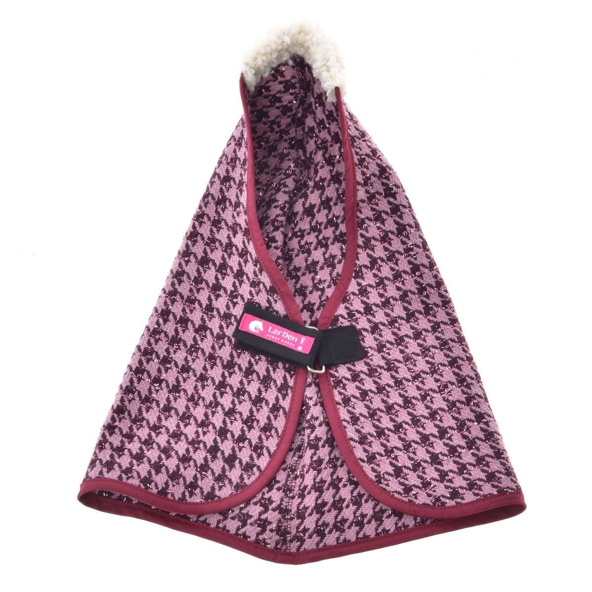 The Stable Blanket Winter Magic by Hobby Horse LarDen features pink and black houndstooth PES fabric, burgundy trim, a fluffy white collar, black strap fastener, and a pink Loff Petit label—ideal for adding chic style to your hobby horse.