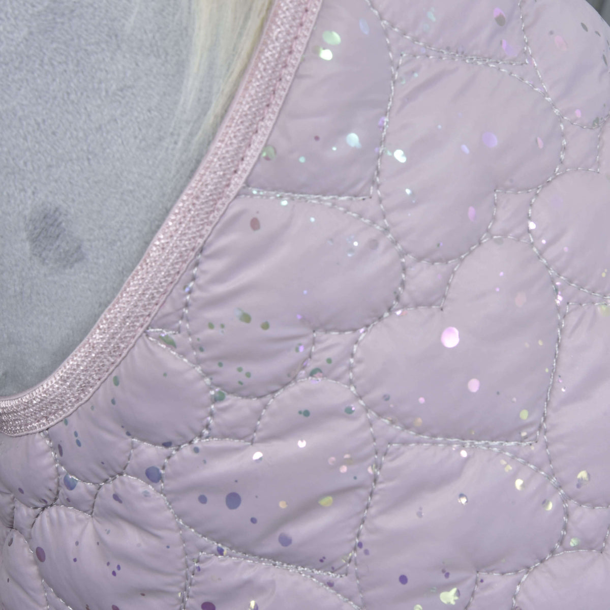 Close-up of the quilted, shiny light purple fabric with iridescent sequins and shimmery trim from the Set Sweetest Heart by Hobby Horse LarDen, likely part of a blanket or ear bonnet designed for horse protection.