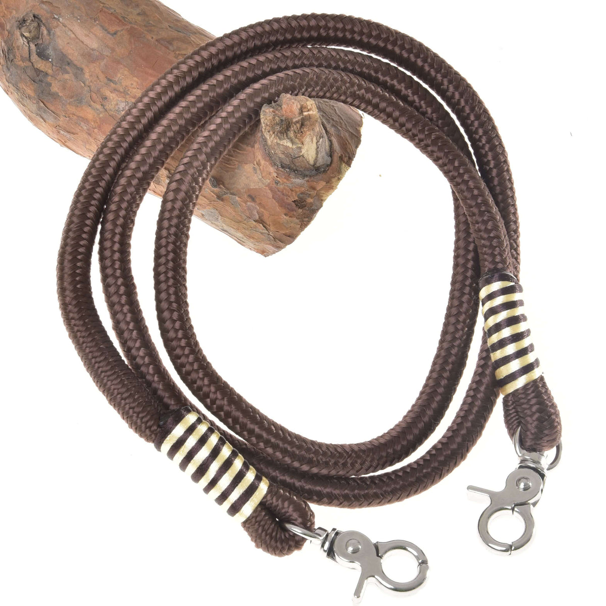 The Reins Vivaldi by Hobby Horse LarDen is a coiled brown polypropylene rope leash with metal clips at both ends, decorated in black, white, and gold—ideal as stylish handmade reins for hobby horses.