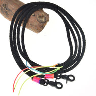 The Split Western Reins Texas by Hobby Horse LarDen features two black braided lanyards with black snap hooks, colorful thread wraps, and vibrant neon strings tied near the hooks, each attached to a wooden piece.