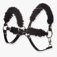 The Hobby Horse LarDen Black halter with complete black fur is a leatherette halter featuring metal rings, buckles, and soft black padding for comfort. Shown against a white background.