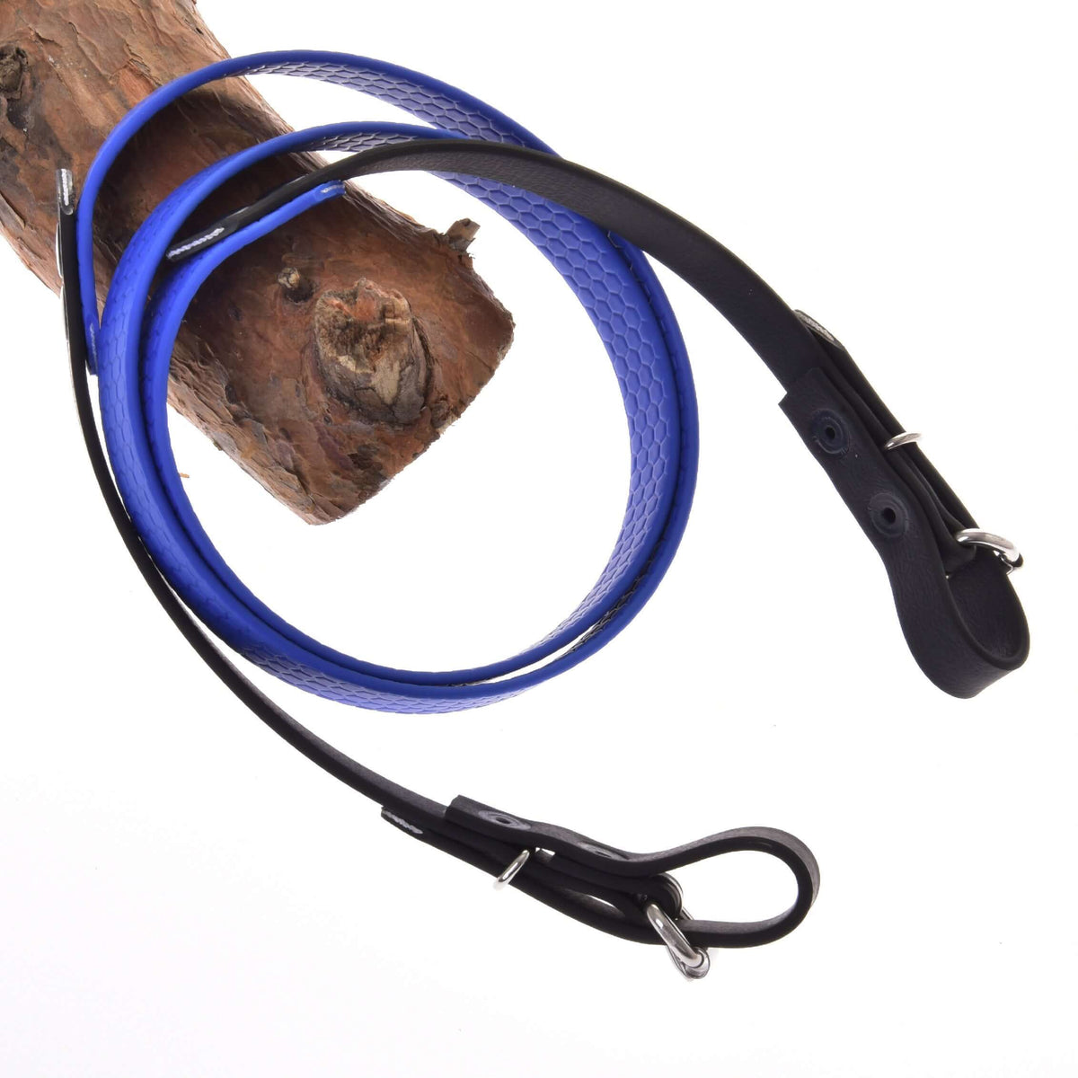 The Hobby Horse LarDen Rubberized reins blue, featuring metal clasps and buckles on both ends, are looped around wood and set against a white background.