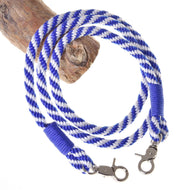 The Hobby Horse - Reins blue stripe by Hobby Horse LarDen features a blue and white twisted polypropylene rope with metal clips on each end, ideal as handmade reins or for hobby horse play. Shown looped around wood on a white background.